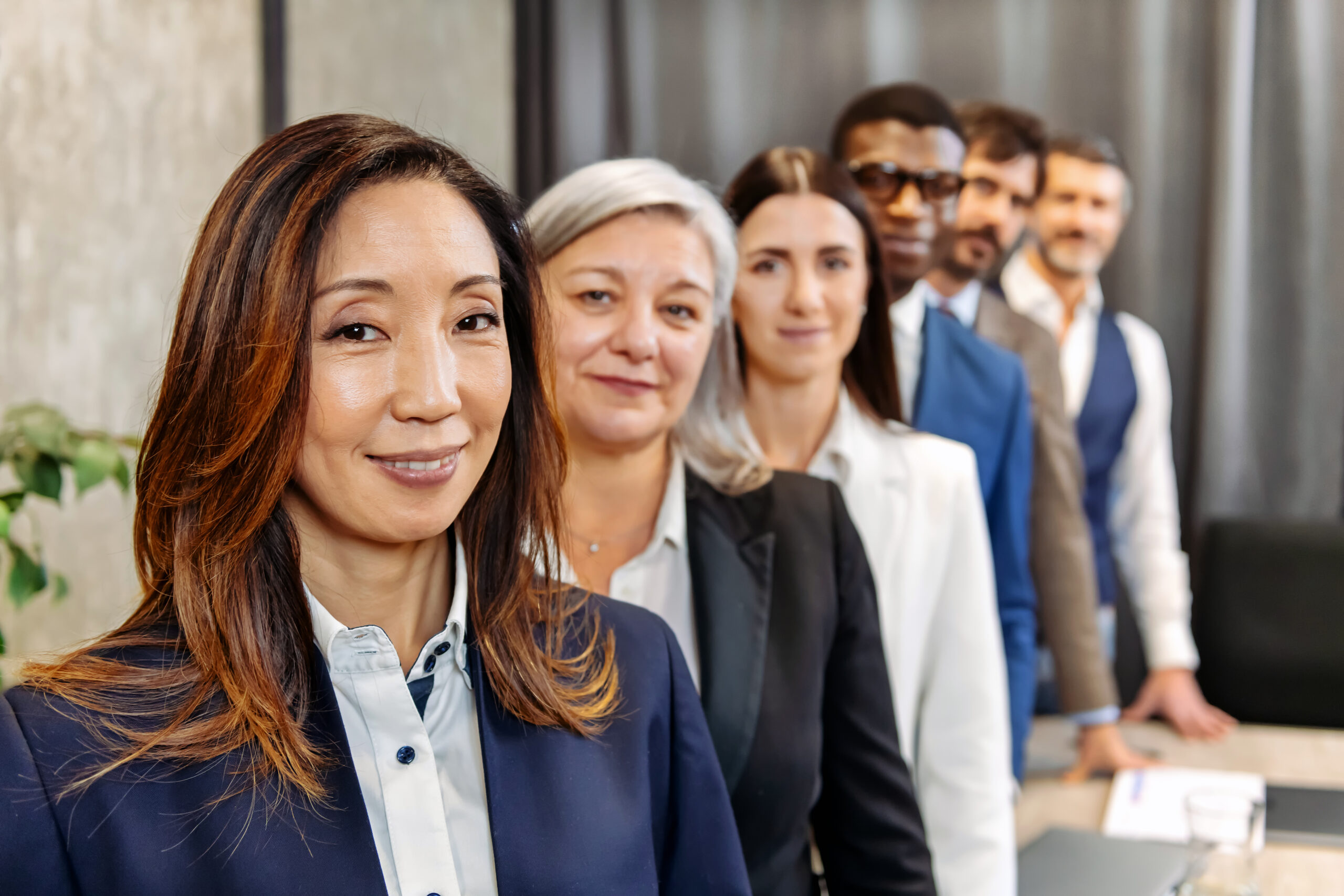 Multiracial businesspeople standing in row